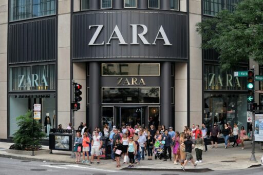 a group of people waiting to hear about zara first responder discount outside of store