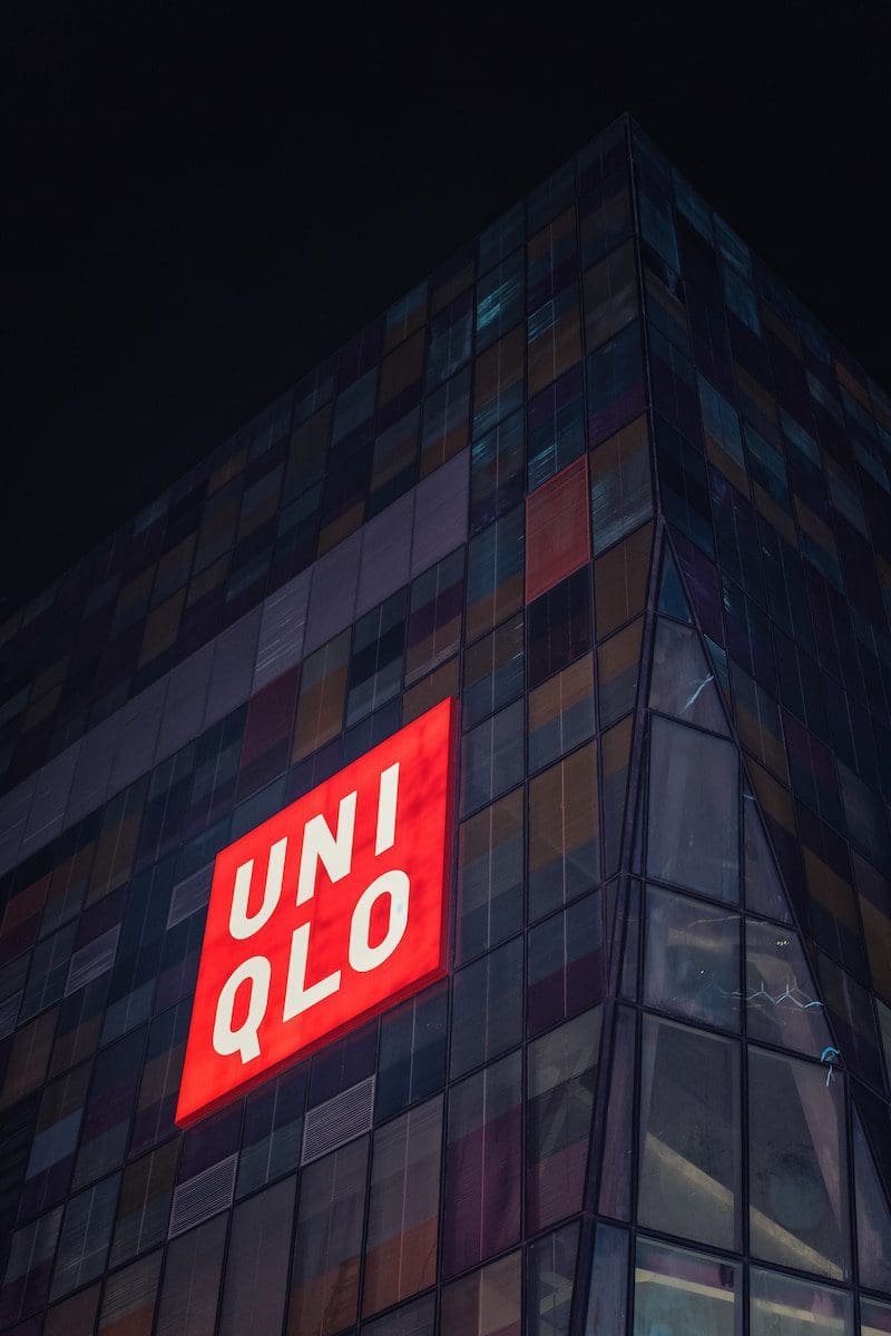 uniqlo building with a red sign on the side of it