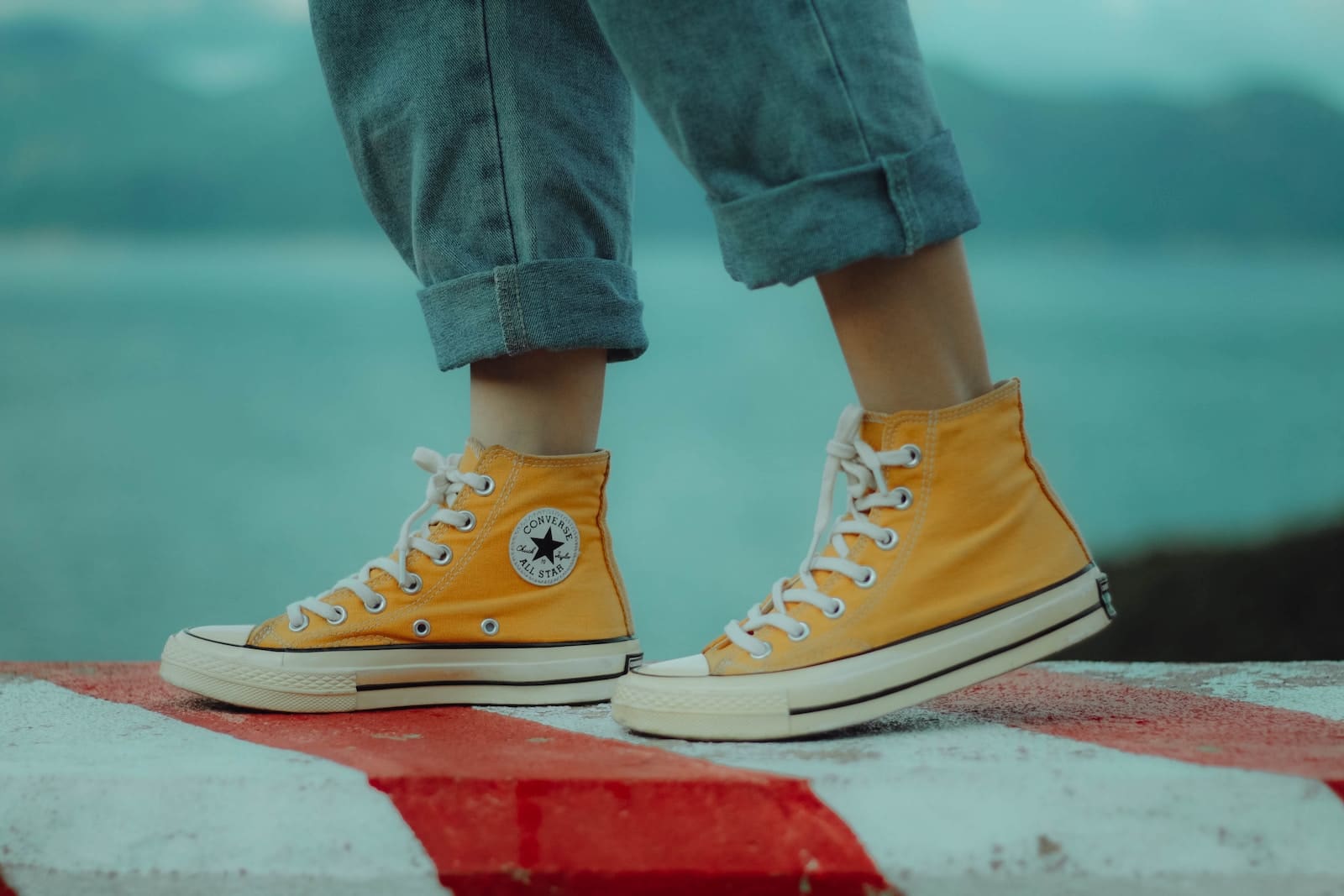 person wears yellow orange Converse All-Star high-top sneakers on their birthday