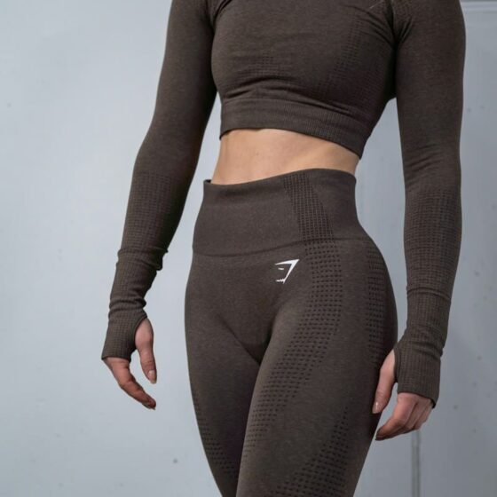 a woman in a gymshark brown top and leggings