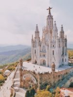 people walking near barcelona church during daytime