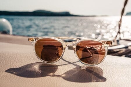 white framed brown lens electric sunglasses