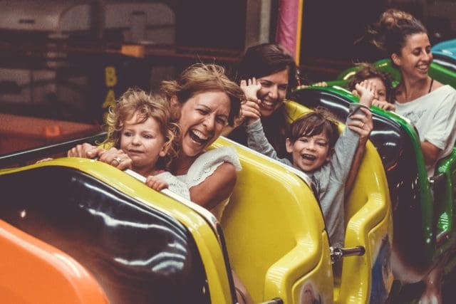 people riding on hersheypark roller coaster during daytime