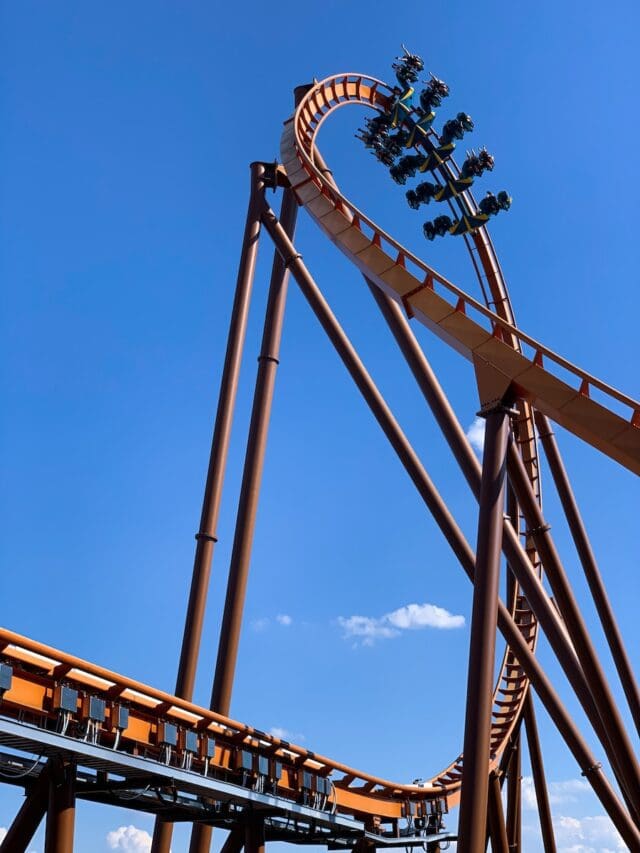 brown metal tower under blue sky at holiday world